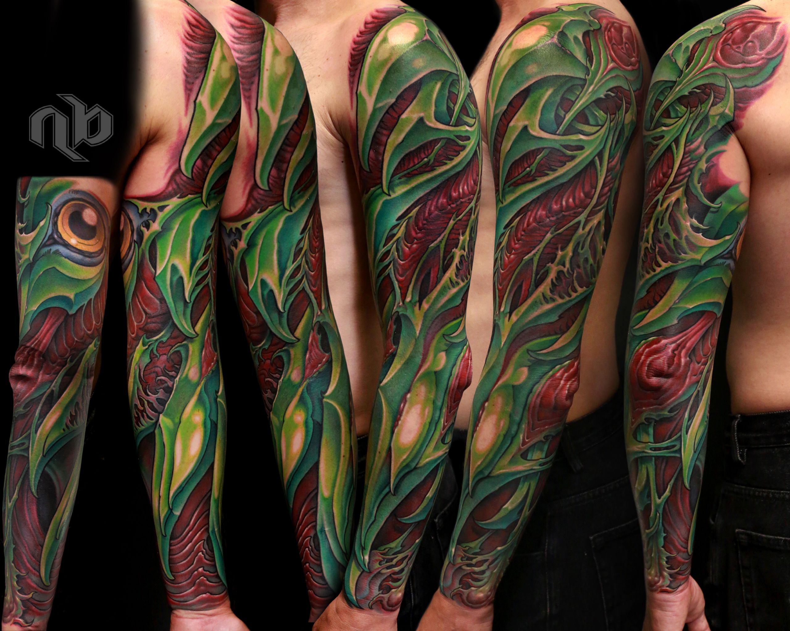 green and red bio organic sleeve tattoo inspired by parrot bird colors and shapes.