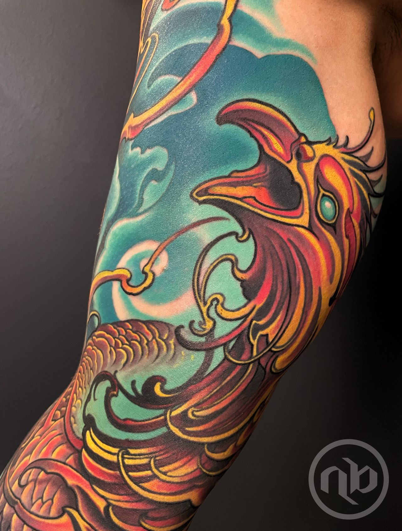 colorful red and yellow phoenix bird head swirling in flight
