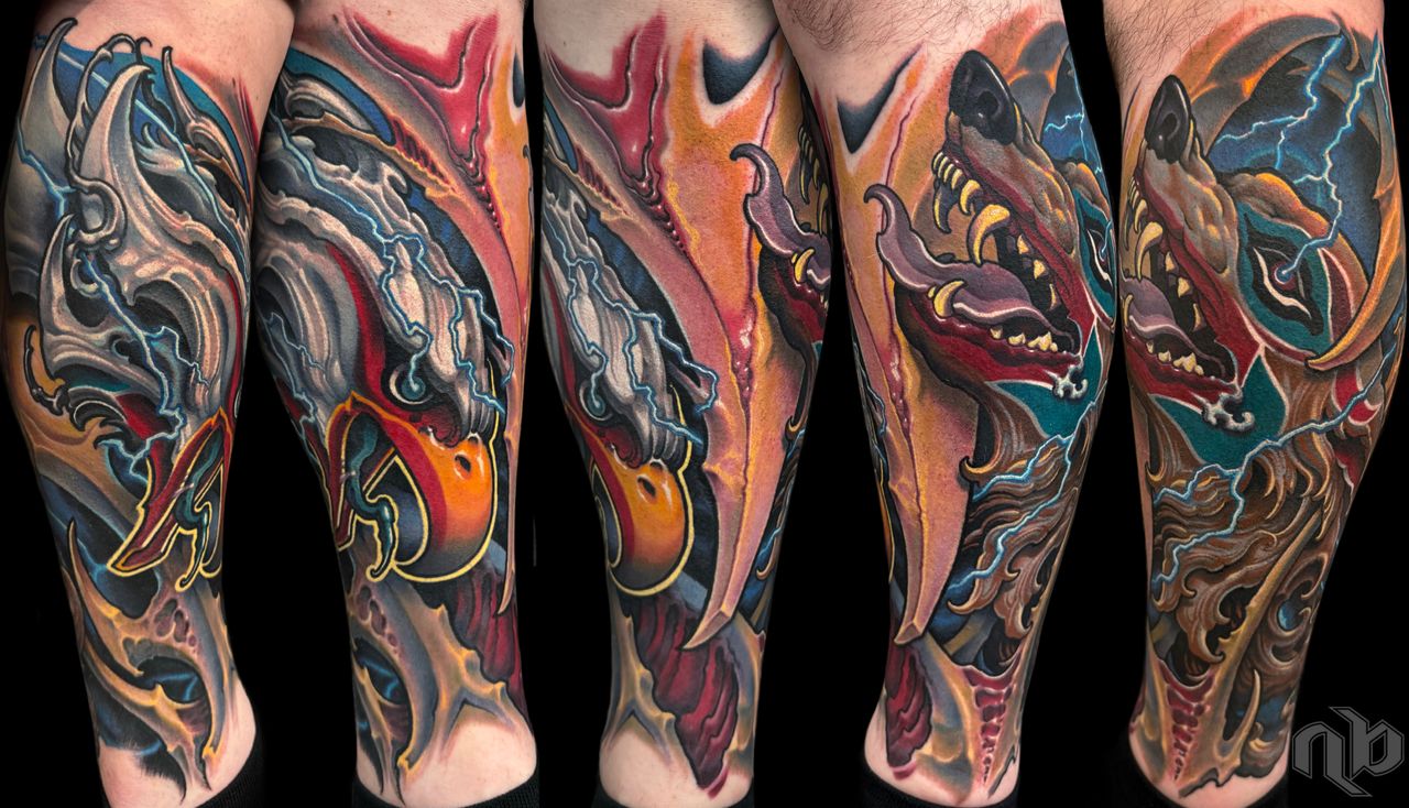 Bio organic style color tattoo with an eagle and wolf head homage to native american tribes of the pacific northwest