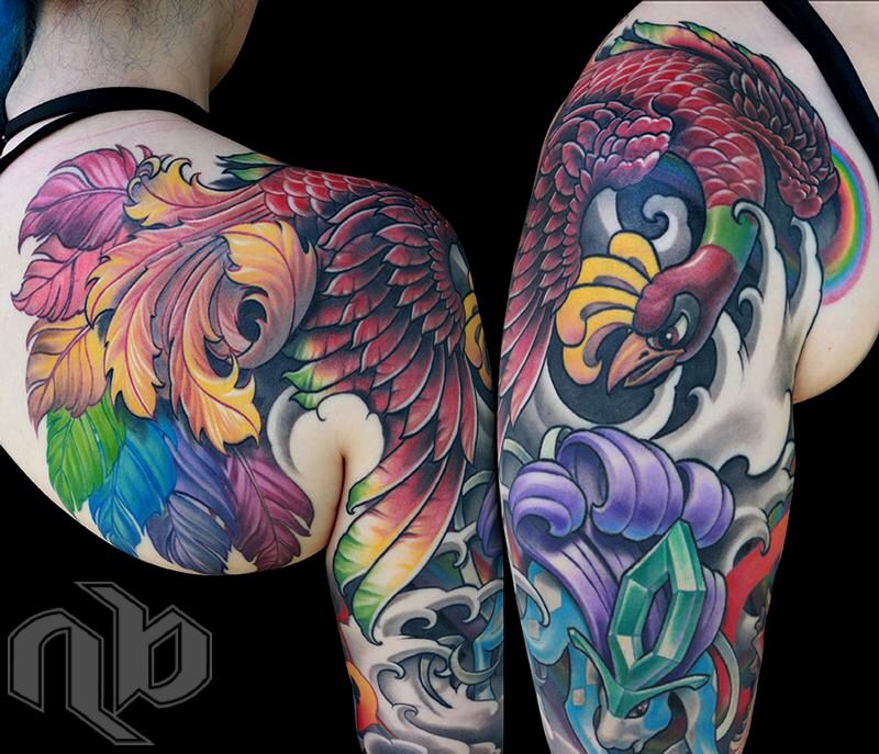 Two views show a large, vivid arm tattoo of feathered Pokémon amid stylized waves, clouds, green crystals, and a small rainbow.