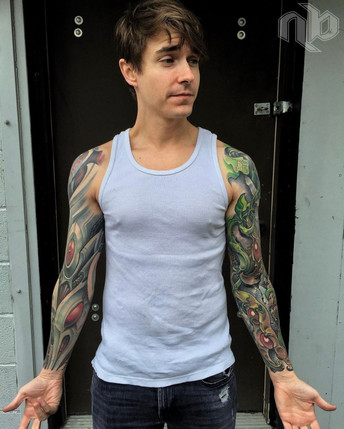 David with his 2 completed sleeves, one bio-organic and one biomechanical, by nick baxter in austin texas
