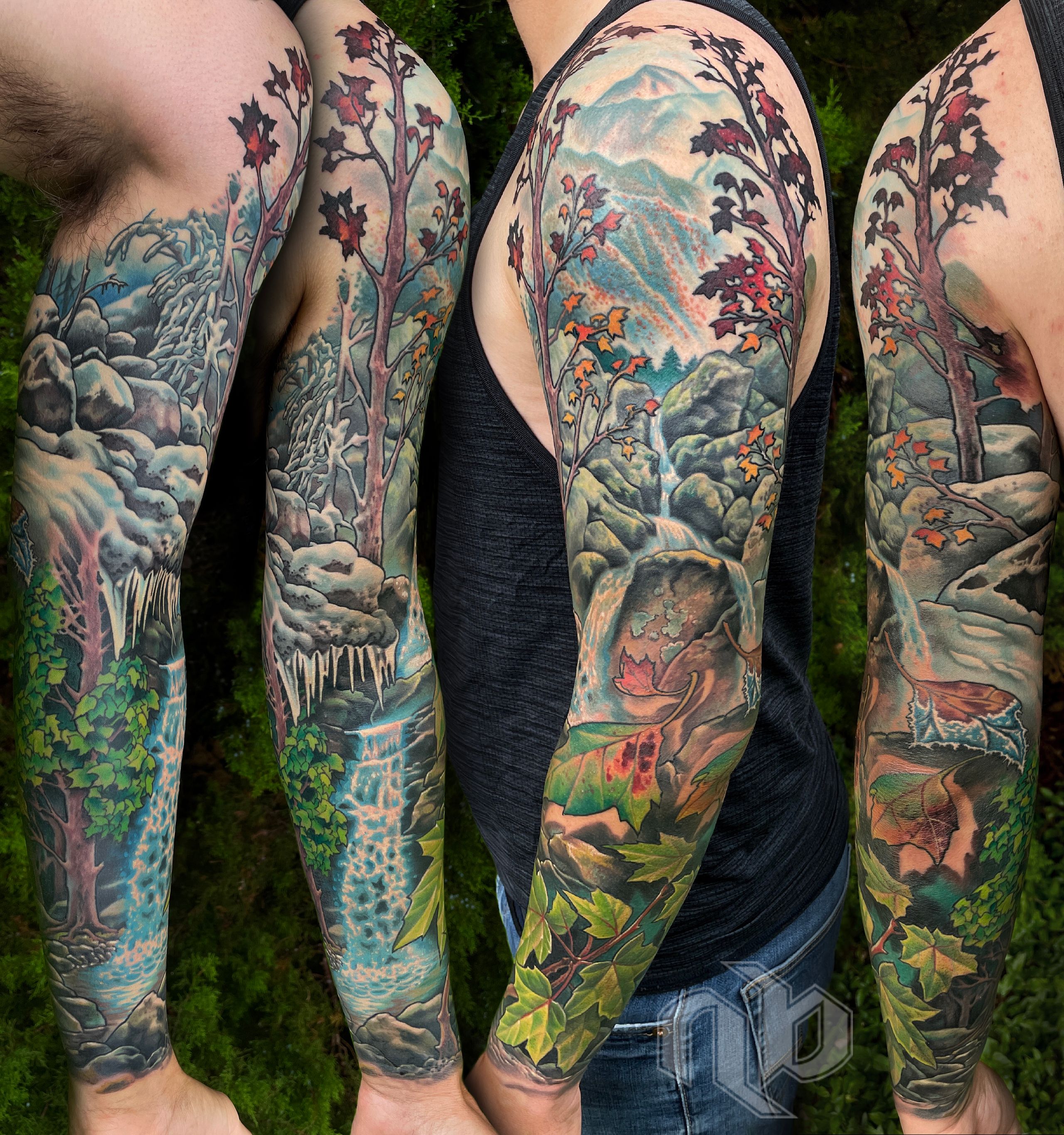 Four views of a large arm tattoo show trees, waterfalls, mountains, snow, autumn leaves, and green foliage in vivid blues and reds.