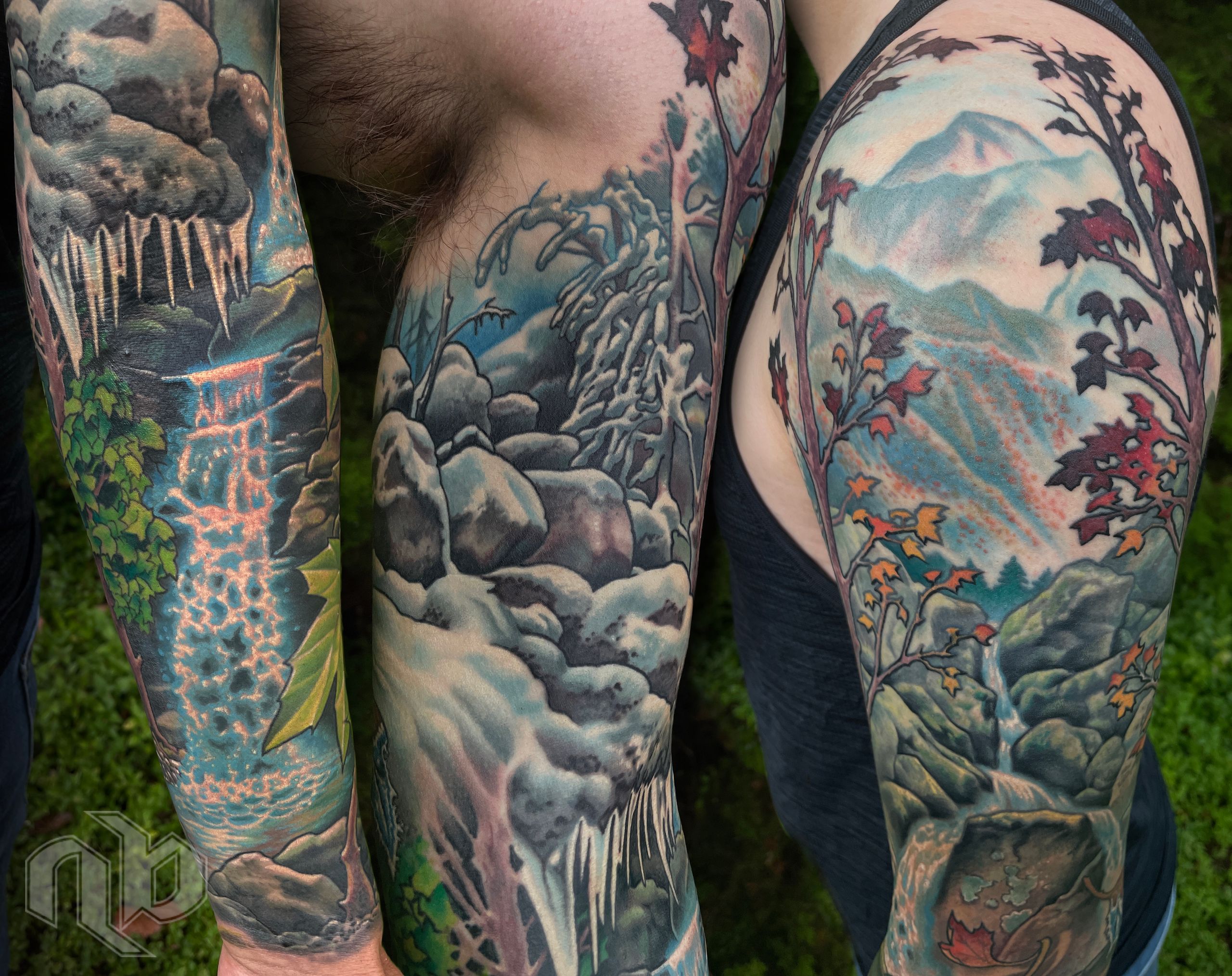 Three close views of a large arm tattoo show waterfalls, rocky mountains, snow, green foliage, and red-orange autumn leaves in blue-grey tones.