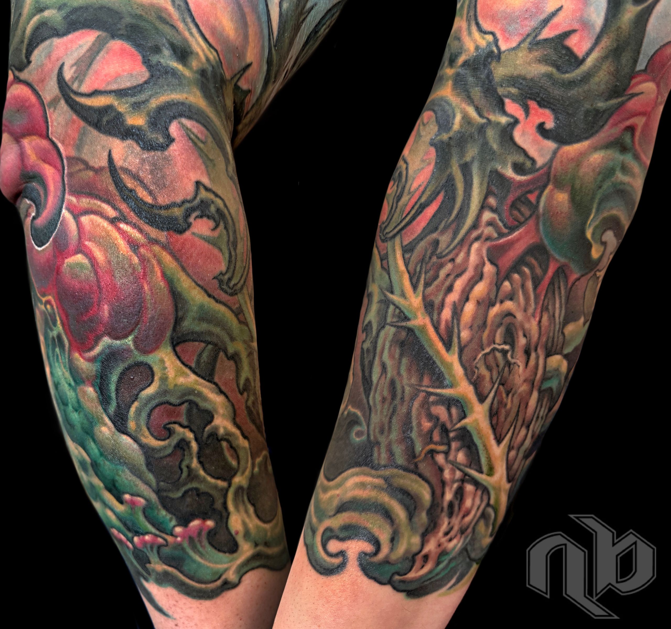 Color textured abstract bio-organic tattoo sleeve with roots, vines, thorns and floral growth by Nick Baxter in Austin Texas
