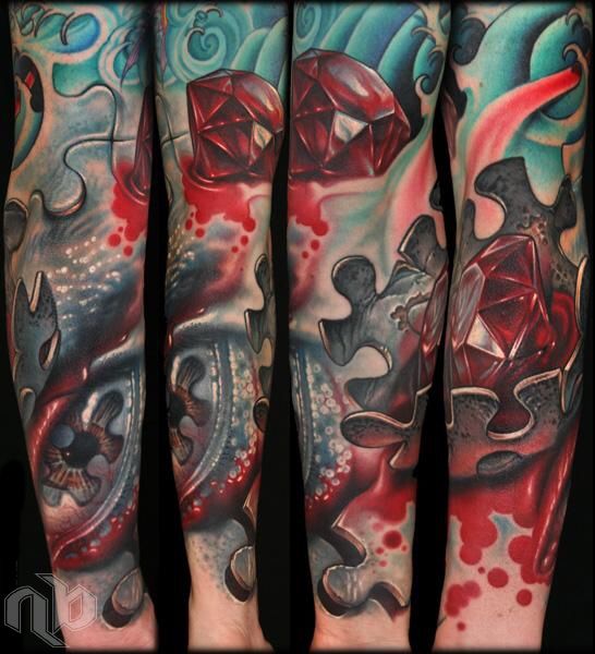 surreal color arm tattoo of puzzle piece with blood and human eye with red diamond by nick baxter in austin texas