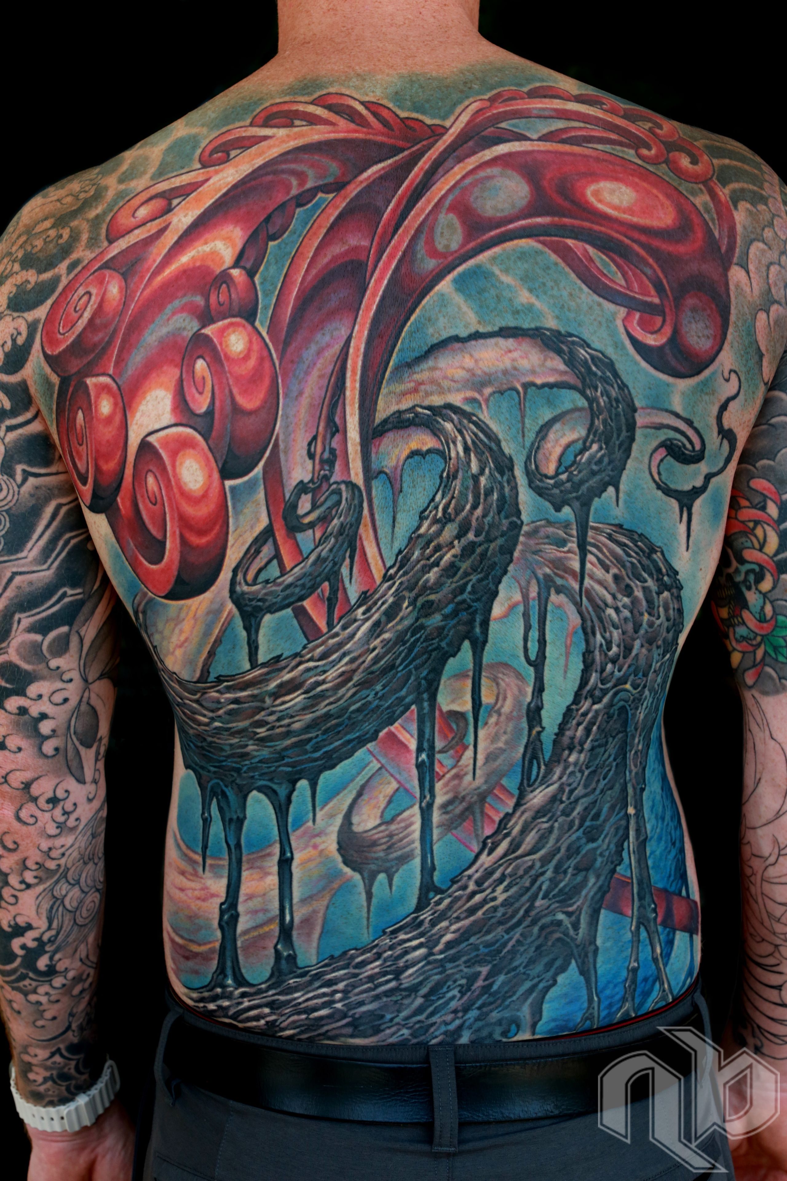 Color textured abstract bio-organic tattoo backpiece with roots, vines, and shiny spiral growth by Nick Baxter in Austin Texas