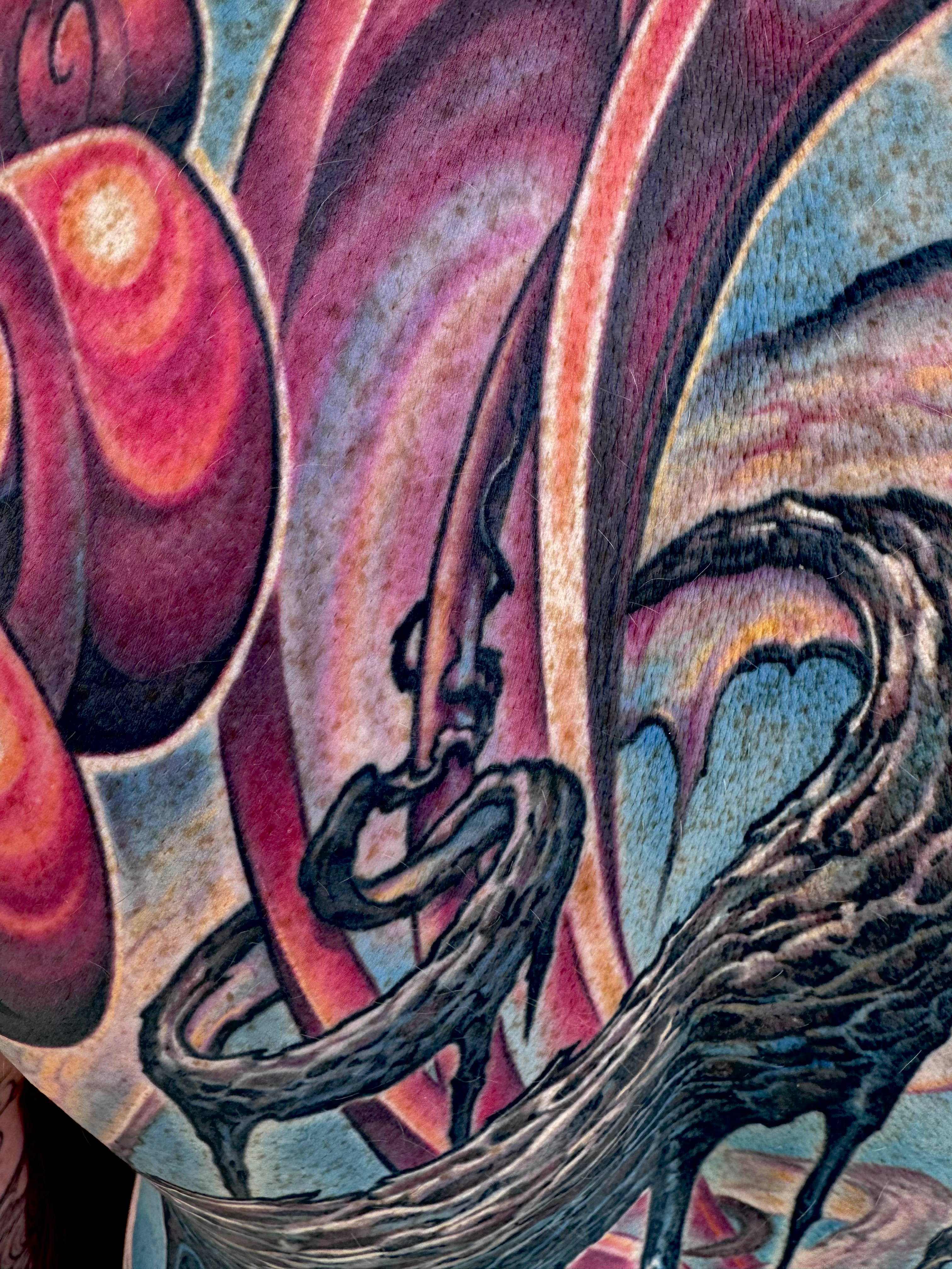 Color textured abstract bio-organic tattoo backpiece with roots, vines, and shiny spiral growth by Nick Baxter in Austin Texas