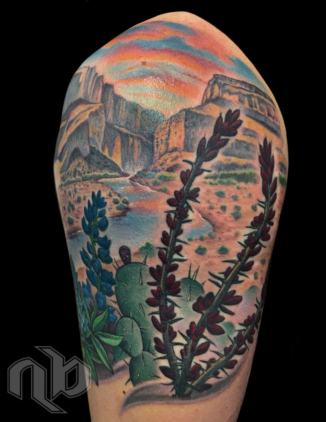 west texas themed big bend desert landscape color tattoo with cactus and the rio grande river in the background by nick baxter in austin texas
